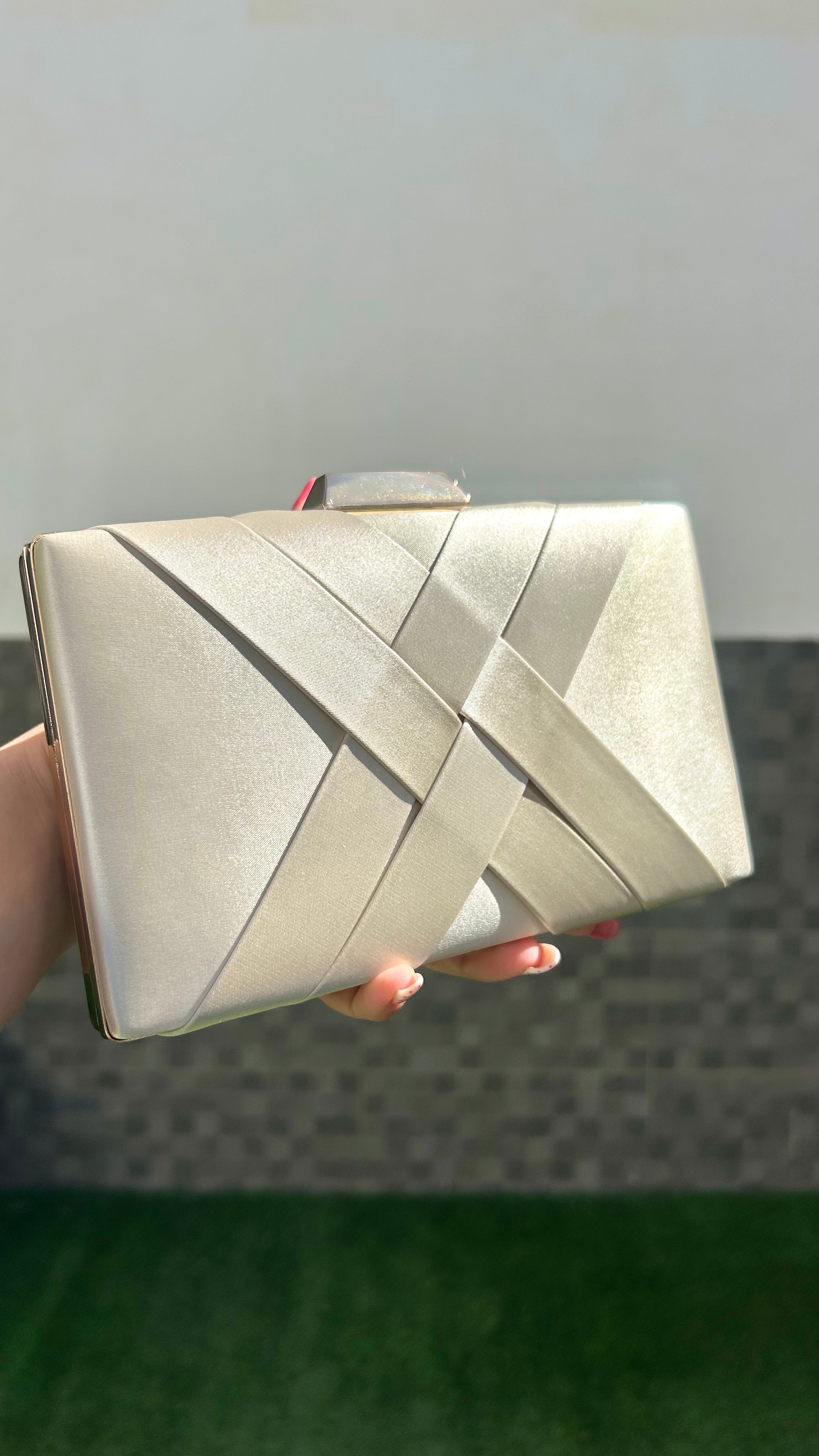 Gold interlaced satin clutch