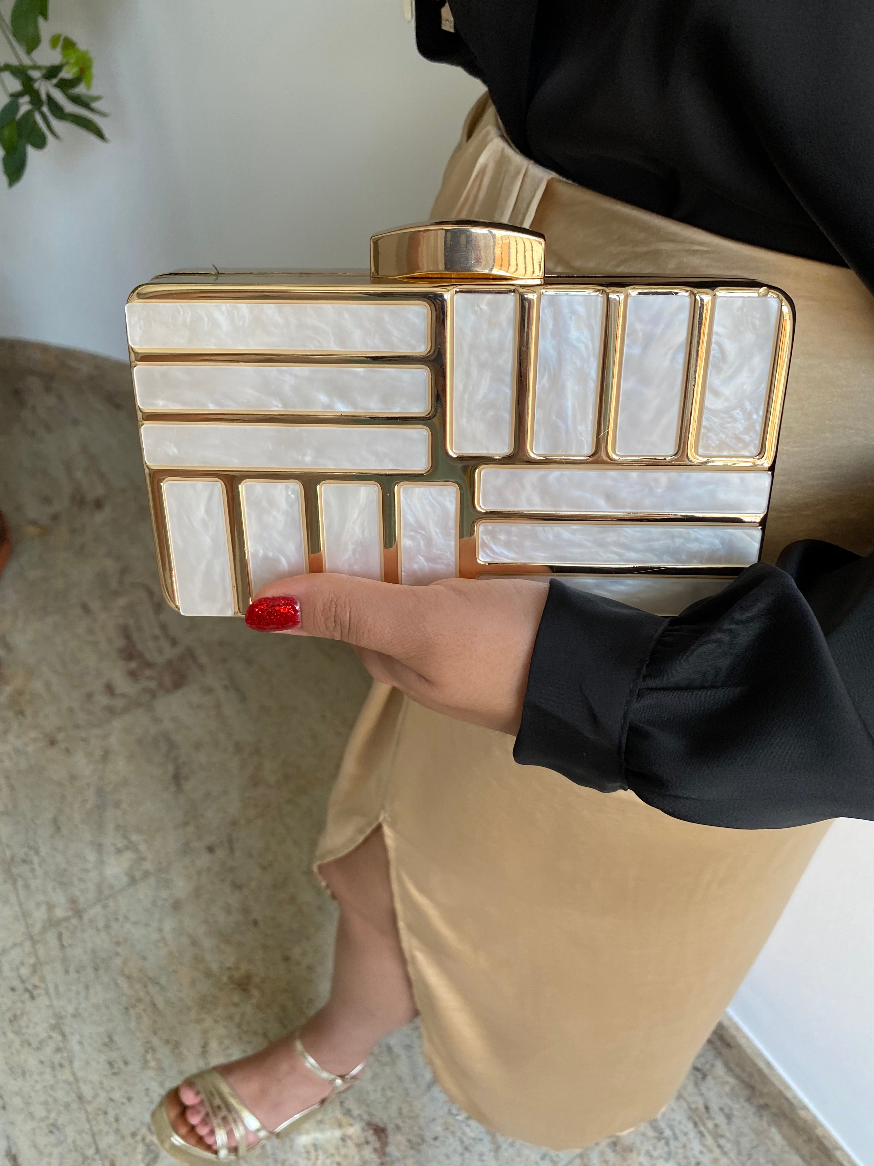 Gold marble effect clutch
