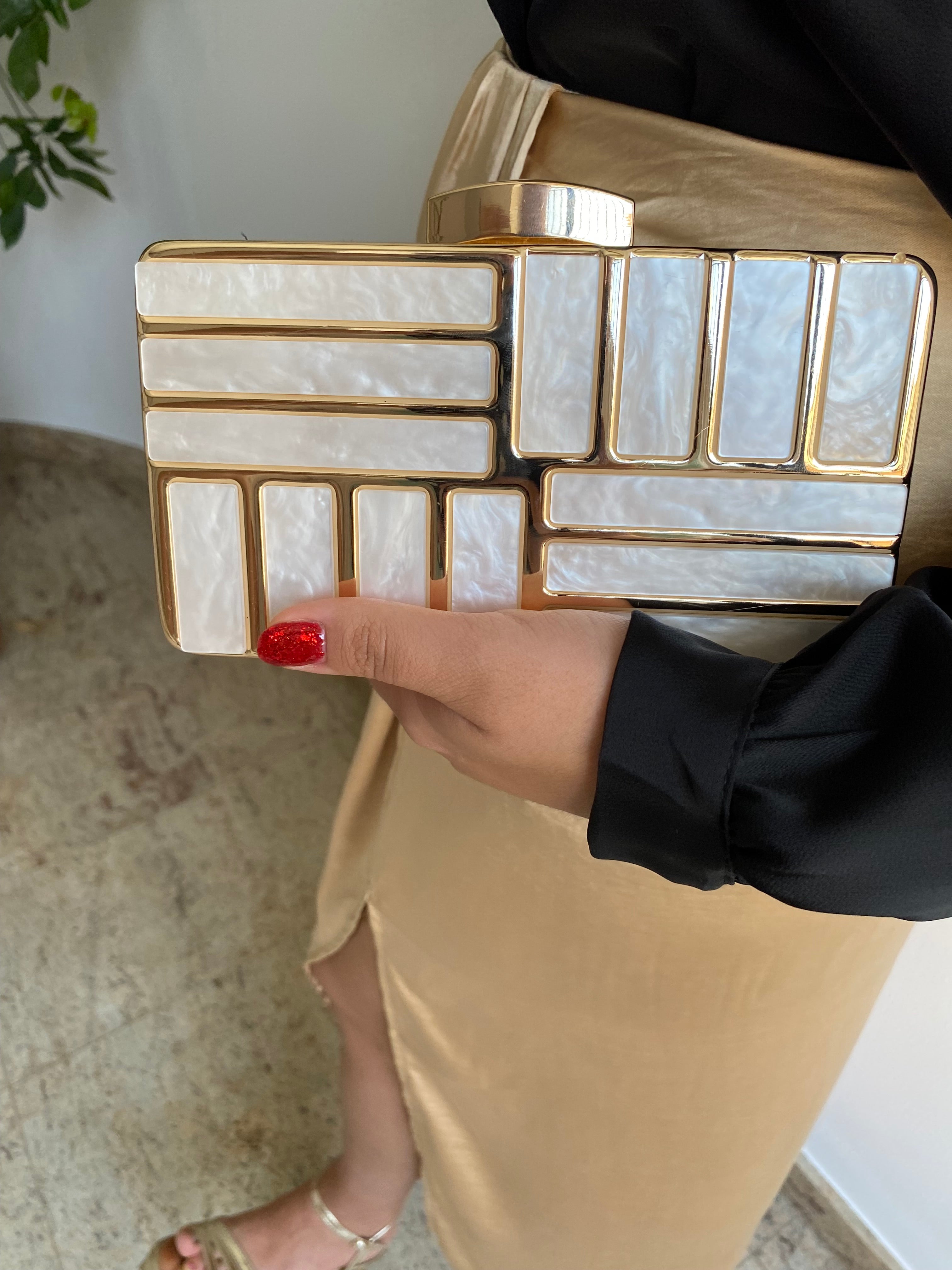 Gold marble effect clutch