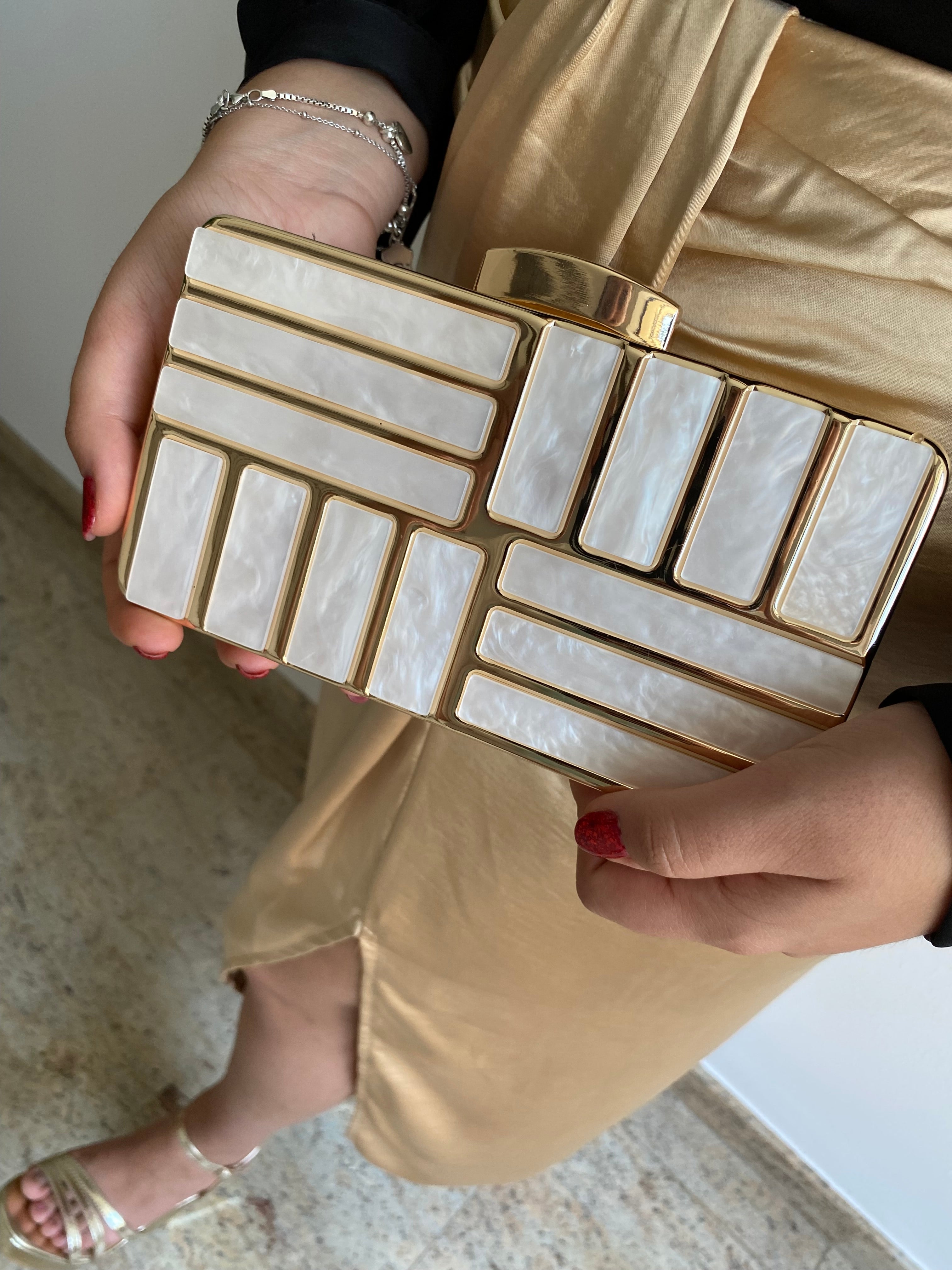 Gold marble effect clutch